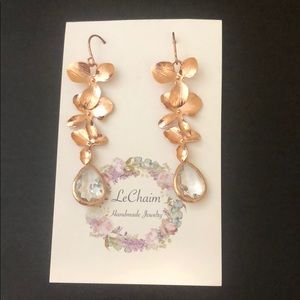 Copper colored earrings with faux diamond bottom